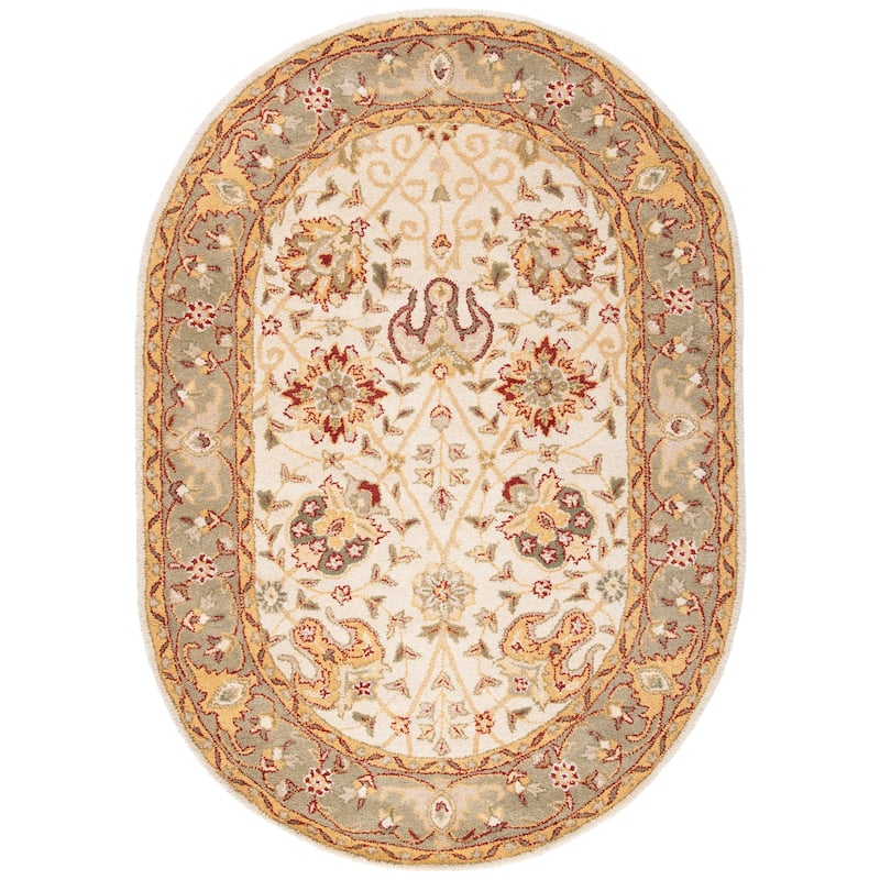 SAFAVIEH Handmade Antiquity Mazie Traditional Oriental Wool Rug - 4'6" x 6'6" Oval - Ivory