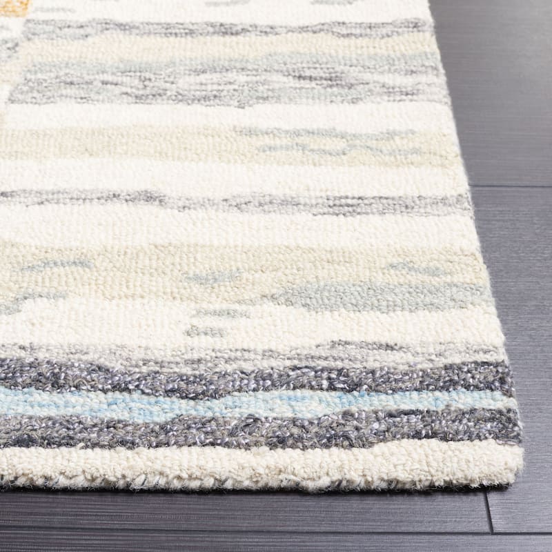 SAFAVIEH Handmade Ebony Bassima Modern Wool Rug