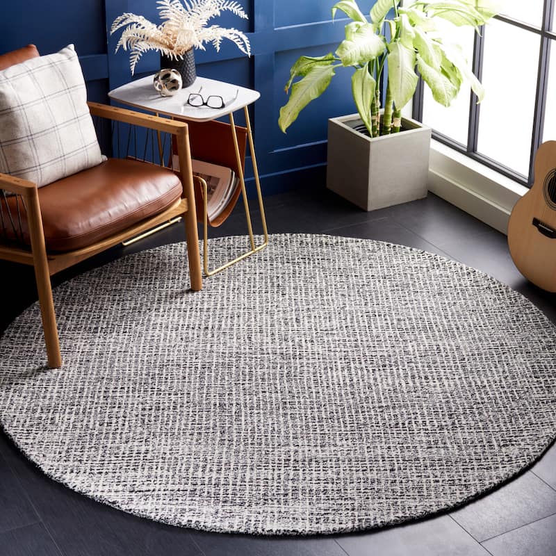 SAFAVIEH Handmade Abstract Lottie Modern Wool Rug - 4' Round - Black/Ivory - Round