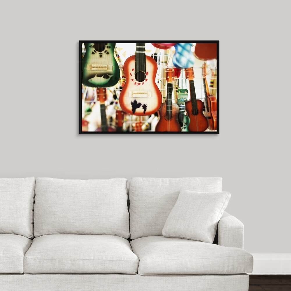 Shop Guitars Hanging On Display Black Float Frame Canvas Art
