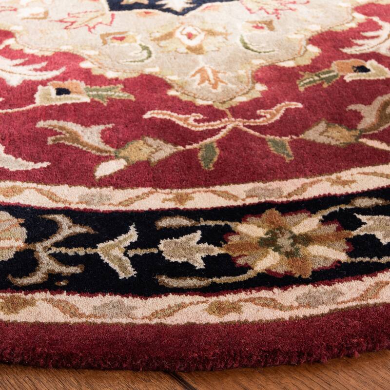 SAFAVIEH Handmade Heritage Harmony Stripe Traditional Oriental Wool Rug - 7'6" x 9'6" Oval - Red/Black