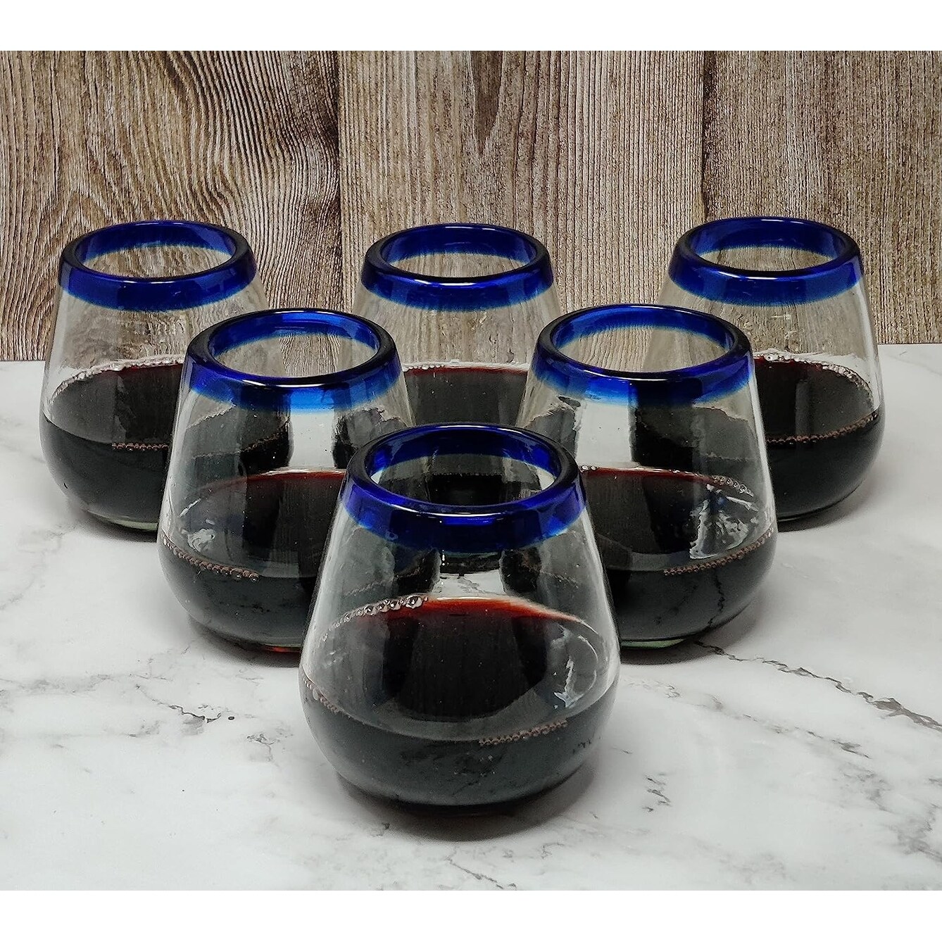 https://ak1.ostkcdn.com/images/products/is/images/direct/60ac70ce4bc95635351f6bcb338a09fd92894227/Hand-Blown-Mexican-Stemless-Wine-Glasses---Set-of-6-Glasses-with-Cobalt-Blue-Rims-%2815-oz%29.jpg