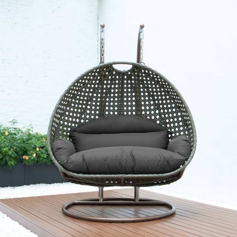 LeisureMod 2-Person Hanging Egg Swing Chair with Metal Stand - Handcrafted Beige Wicker, Patio Hammock Lounger with Cushions