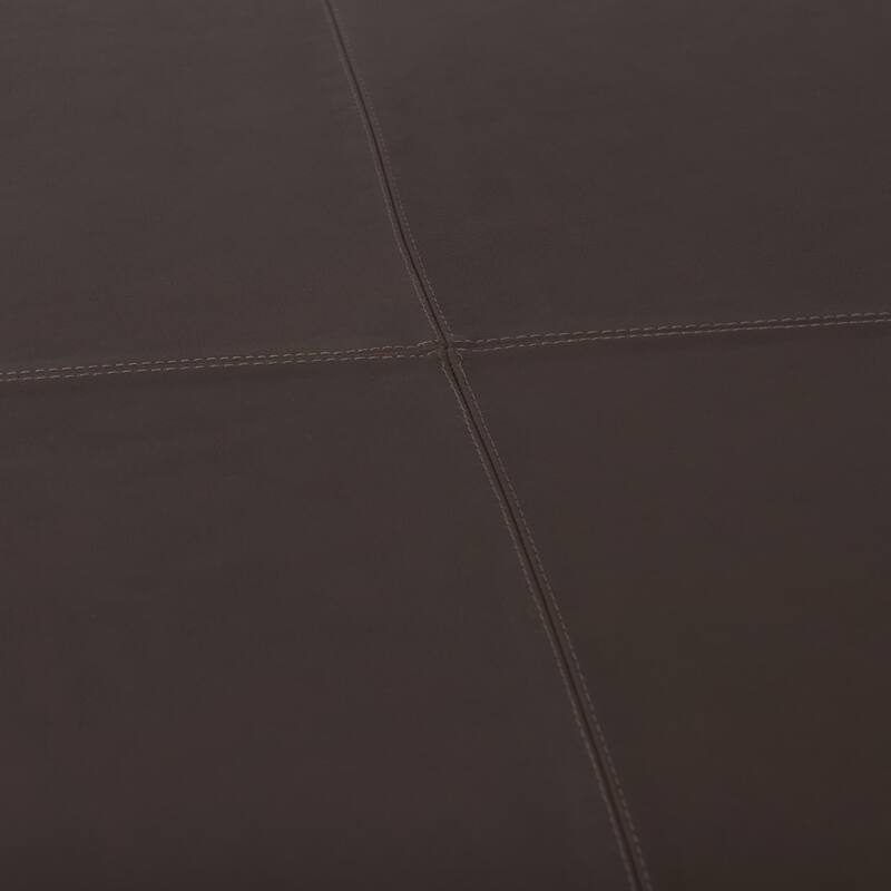 A leather ottoman with versatile style and function.