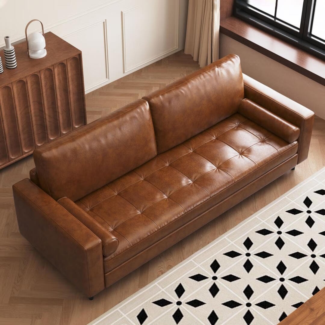Mid-Century Modern Brown Faux Leather Sofa – 3-Seater Upholstered Couch with Bolster Pillows, Tufted Seat, and Solid Wood Frame