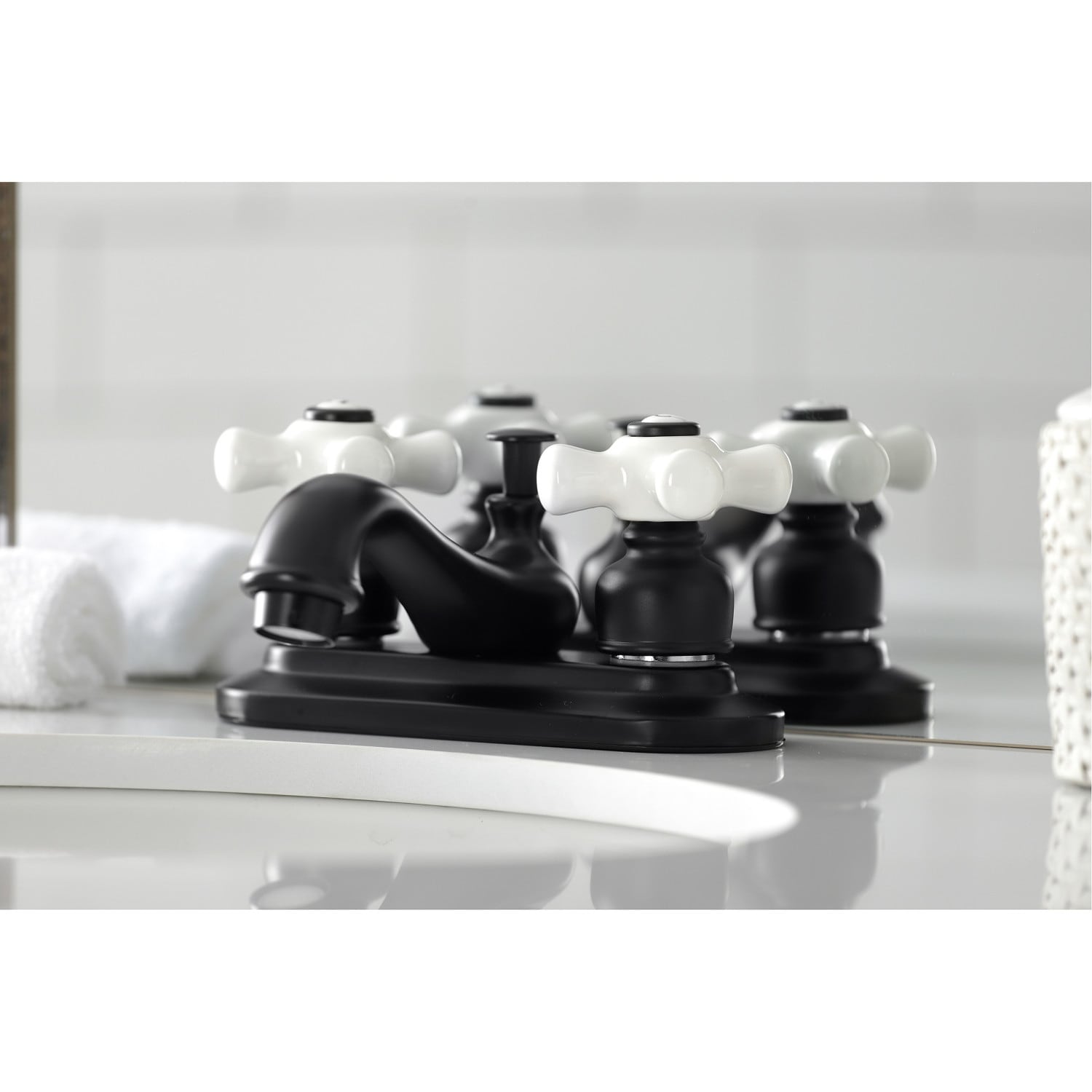 Kingston Brass Restoration Two-Handle 3-Hole Deck Mount 4 in. Centerset Bathroom Faucet
