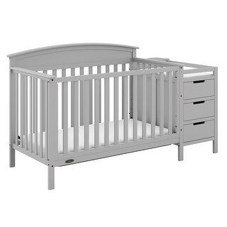 white crib with attached changing table