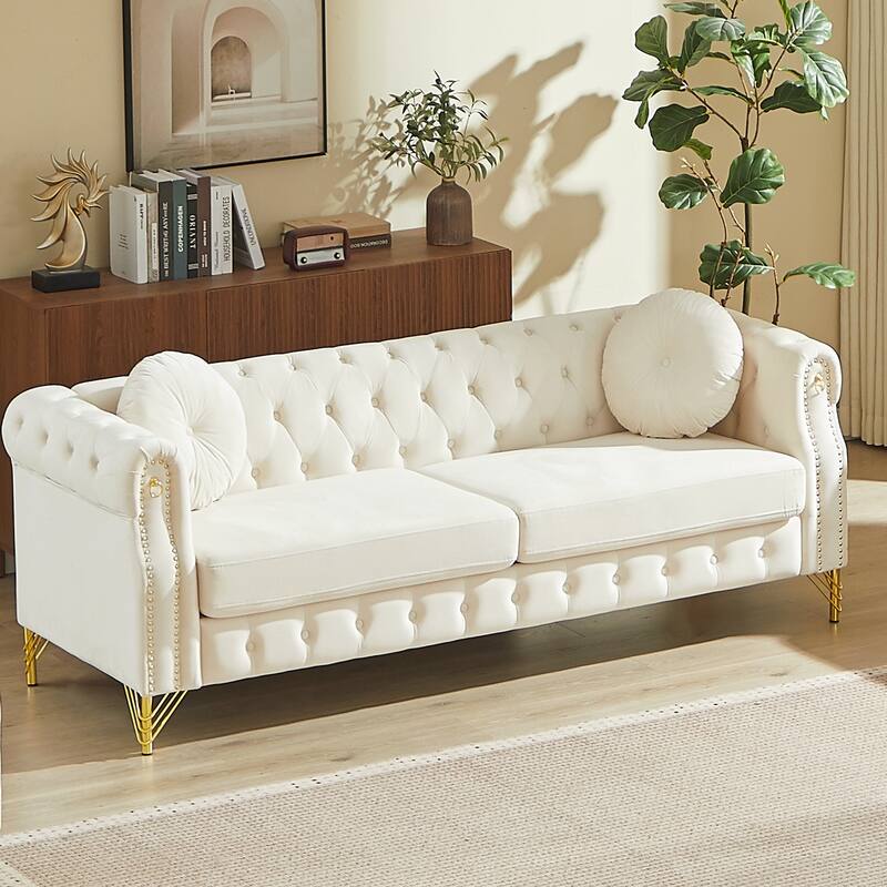 Chesterfield Sofa with Two Round Pillows, Featuring Copper Stud Detailing and Tufted Button Accents