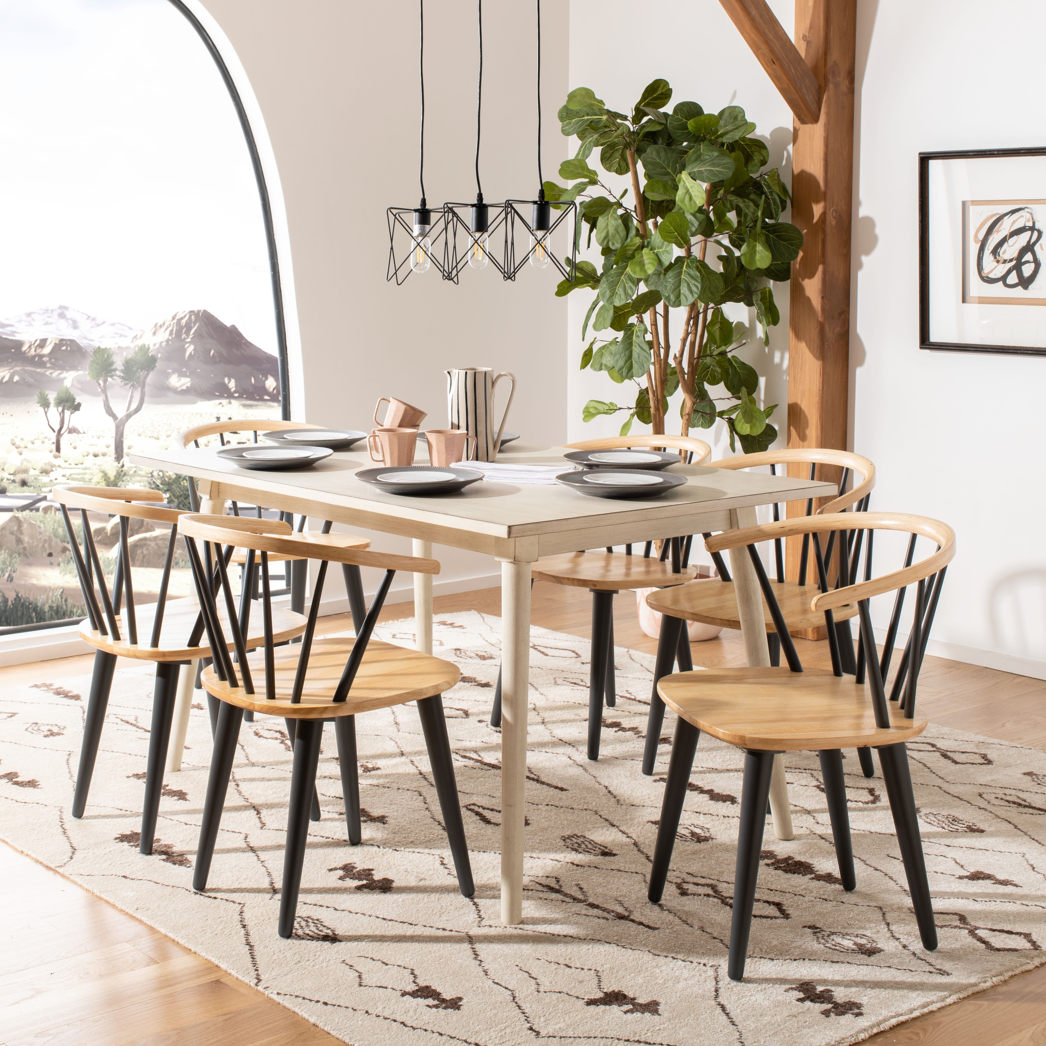 Natural wood table with online black chairs
