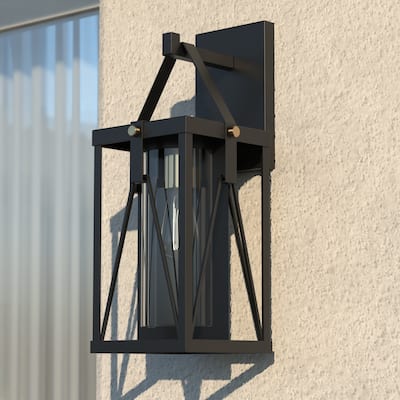Evanston 1 Light Black and Gold Dusk to Dawn Outdoor Wall Lantern Clear Glass - 7-in. W x 16.5-in. H x 8.25-in. D