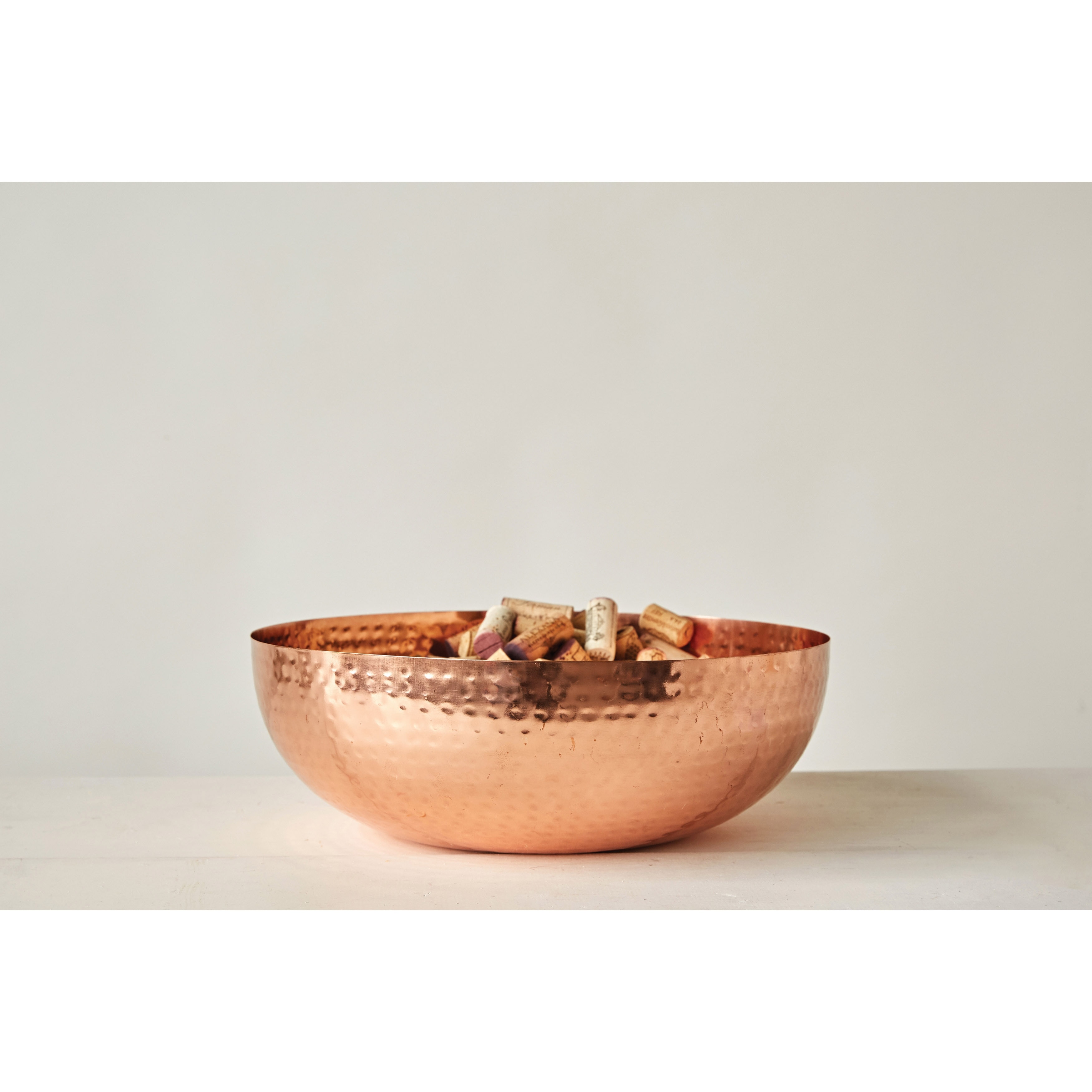 https://ak1.ostkcdn.com/images/products/is/images/direct/62d470038835f32fd944b2bf04eccd8989ef8d35/Hammered-Metal-Bowl-with-Copper-Finish.jpg