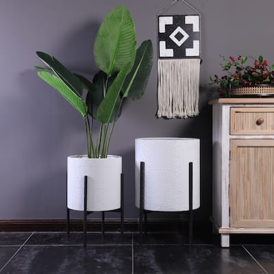 White Floral Stamped Metal Cachepot Planters with Black Stands (Set of 2)