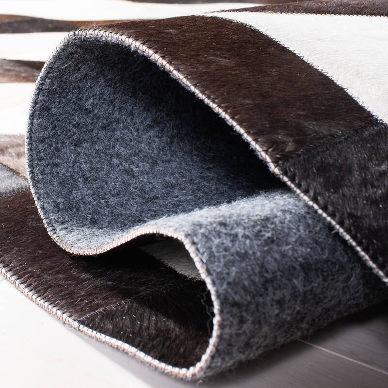 SAFAVIEH Handmade Studio Leather Danyel Modern Rug