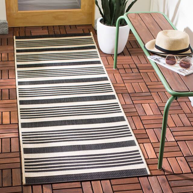 SAFAVIEH Courtyard Charmaine Indoor/ Outdoor Waterproof Area Rug - 2'3" x 8' Runner - Black/Bone