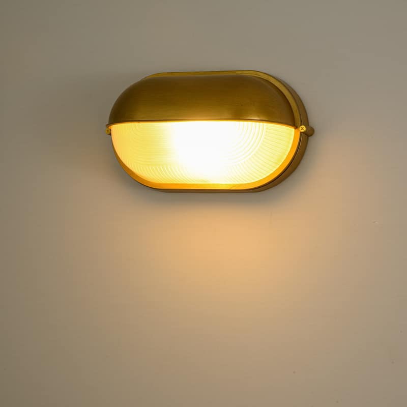 11"W 1-Light Retro 40W Oval Painted Gold Finish Wall Sconce with Clear Rippled Glass - 11.0 in. W x 6.3 in. H x 4.7 in. D