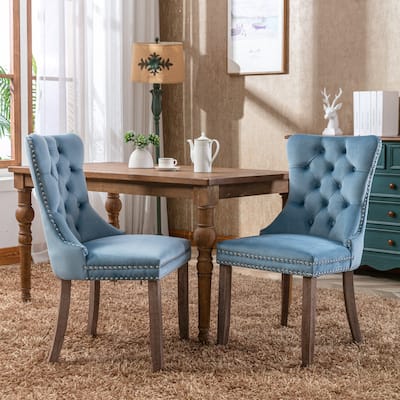 Contemporary Velvet Upholstered Dining Chair with Solid Wood Legs and Nailhead Trim, Offering Luxurious Comfort and Style.