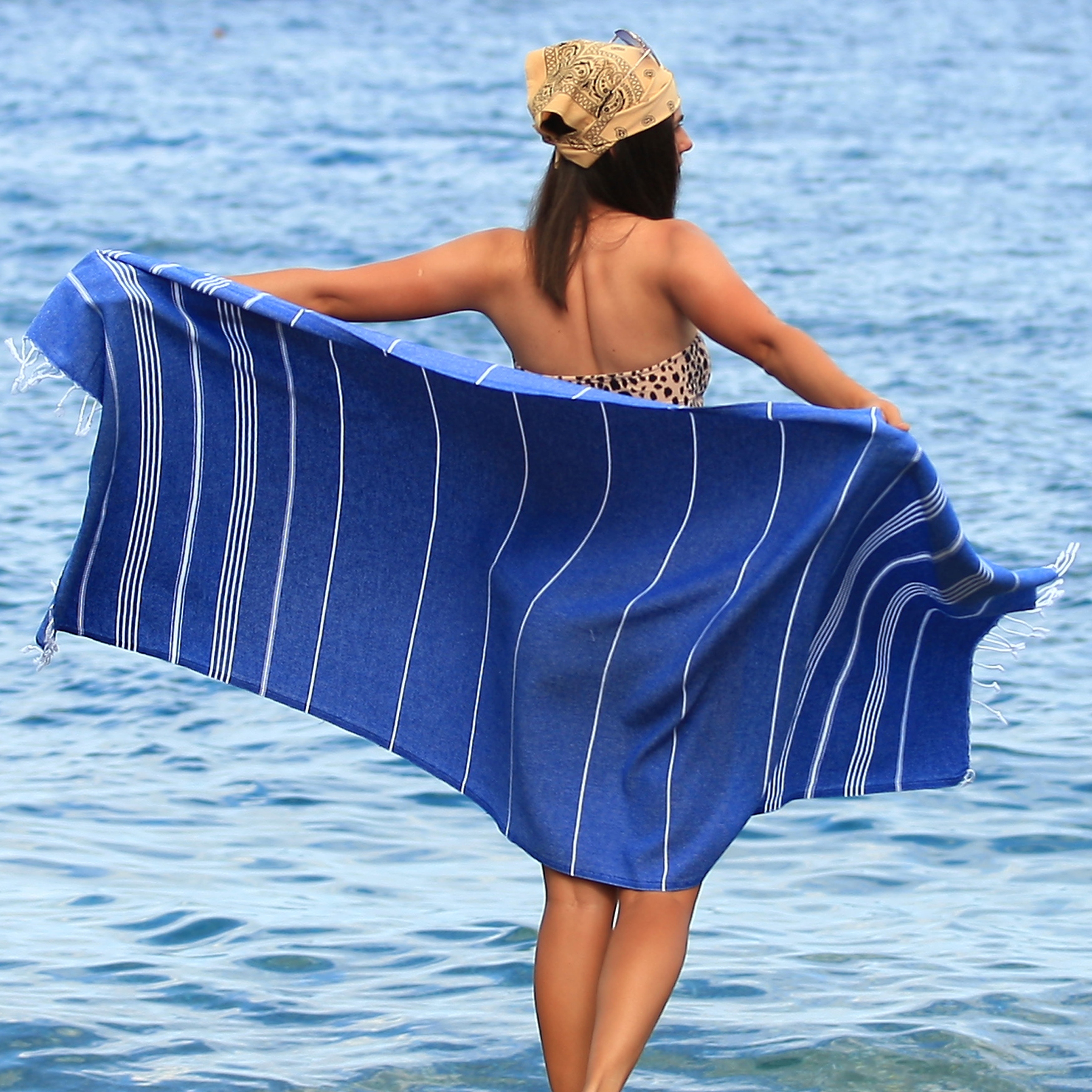 https://ak1.ostkcdn.com/images/products/is/images/direct/64be3c2a32d3a5815c628a5b5c1a6b2ff7b8f259/Lina-Turkish-Beach-Towel-%2838-x-71%29-100%25-Cotton-Absorbent-Prewashed-for-Soft-Feel-Quick-Dry-Sand-free-Multi-use-Beach-Towel.jpg