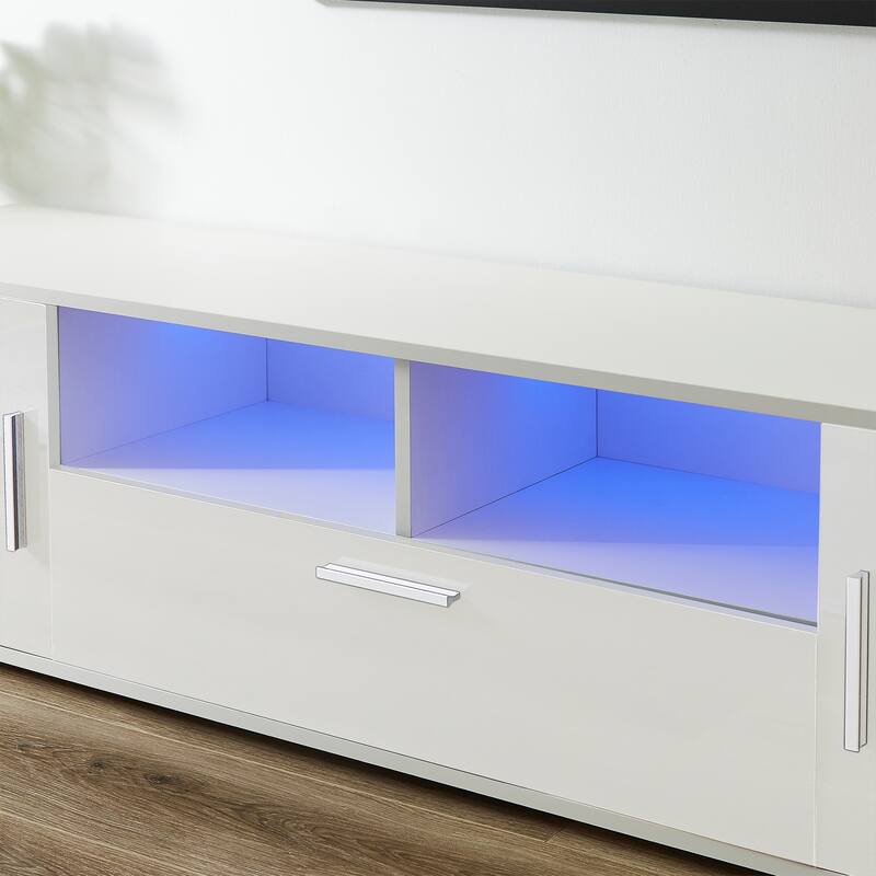 Contemporary TV Console with Remote-Controlled LED Lighting, Holds 65-Inch TVs, Ample Storage & Sturdy Build.