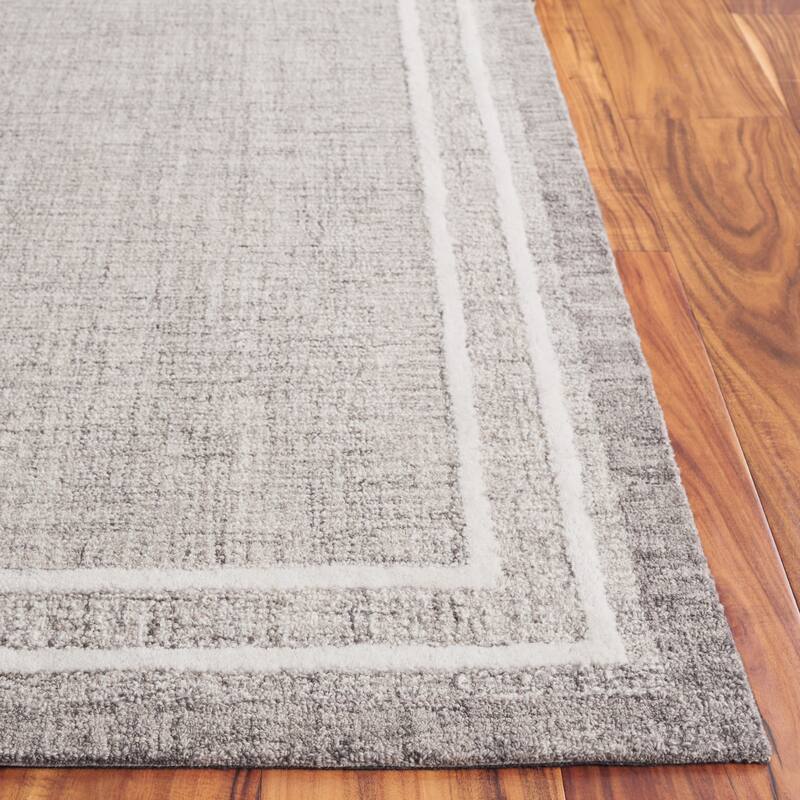 SAFAVIEH Handmade Ebony Gosselke Modern & Contemporary Wool Rug
