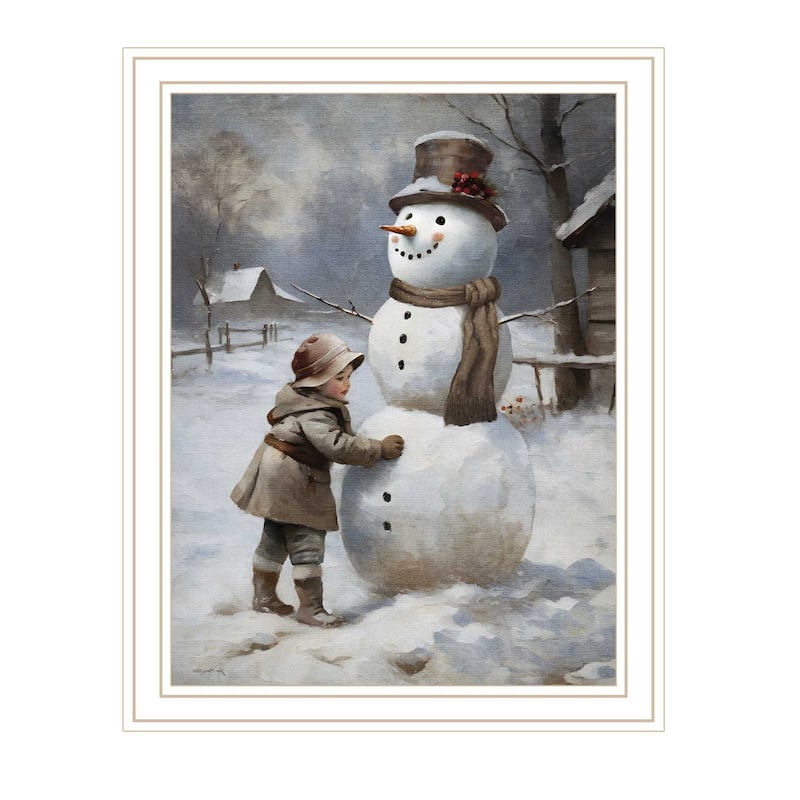 HomeRoots Boy Building A Snowman White Framed Wall Art