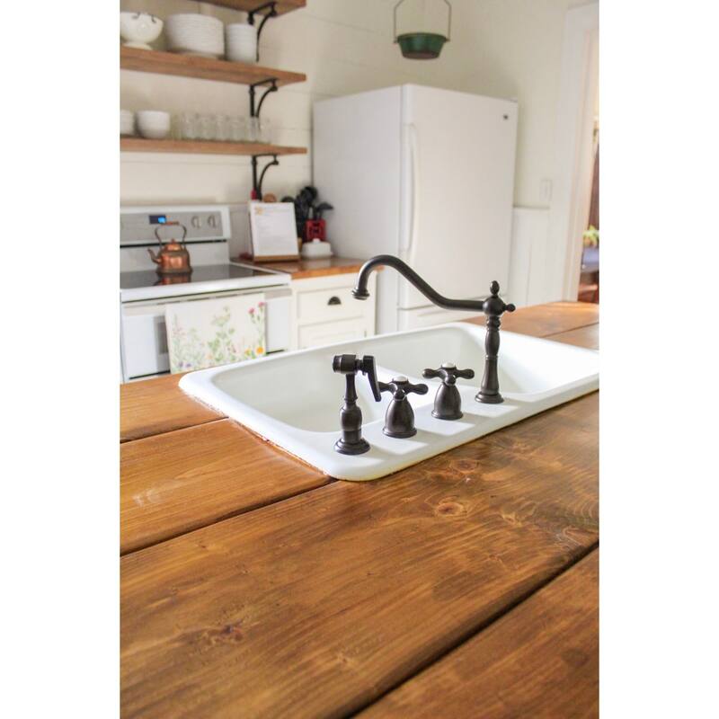 Kingston Brass Heritage 8-Inch Widespread Kitchen Faucet with Brass Sprayer
