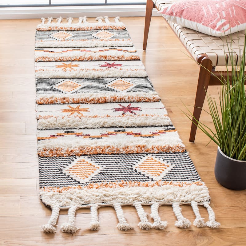SAFAVIEH Hand-knotted Kenya Shanti Wool Tassel Rug - 2'3" x 8' Runner - Ivory/Black-Orange