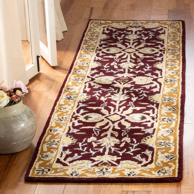SAFAVIEH Handmade Heritage Gabbriella Traditional Oriental Wool Rug - 2'3" x 8' Runner - Red/Gold
