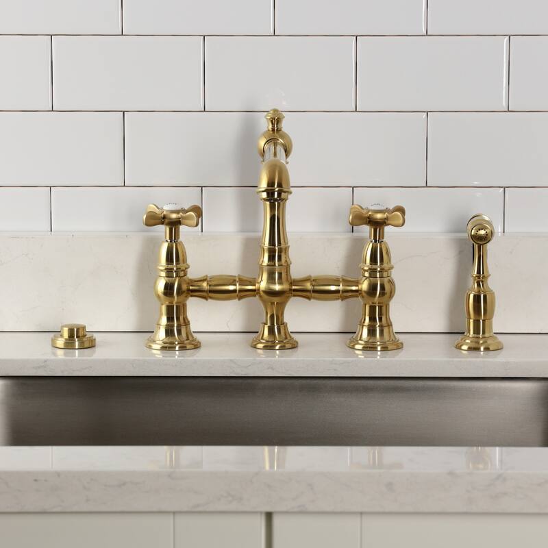 Kingston Brass Essex Two-Handle 4-Hole Deck Mount Bridge Kitchen Faucet with Brass Side Sprayer
