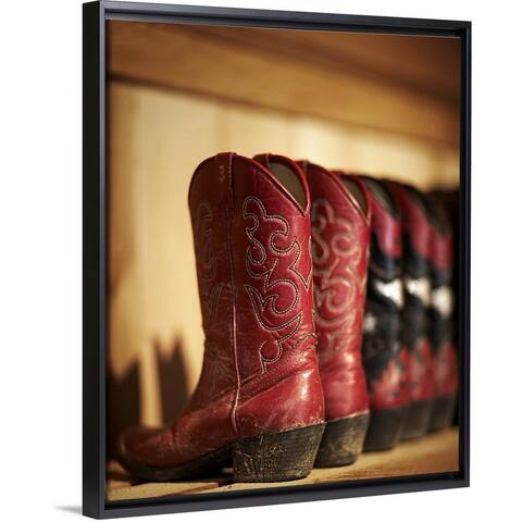 "Row of cowboy boots sitting on a shelf" Black Float Frame Canvas Art