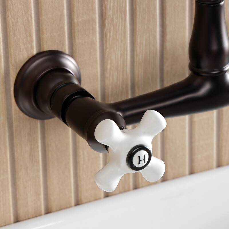 Kingston Brass English Country Two-Handle 2-Hole Wall Mount Bathroom Faucet