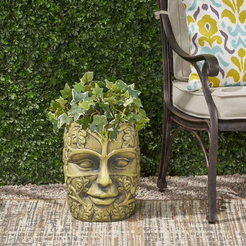 Outdoor stone statue planter with drainage hole, suitable for garden and patio.