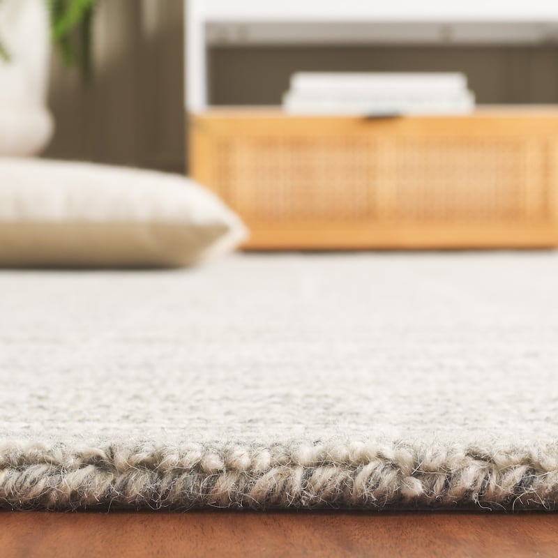 SAFAVIEH Handmade Ebony Peigi Contemporary Wool Rug