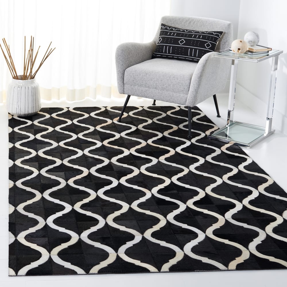 SAFAVIEH Handmade Studio Leather Meagan Mid-Century Modern Rug