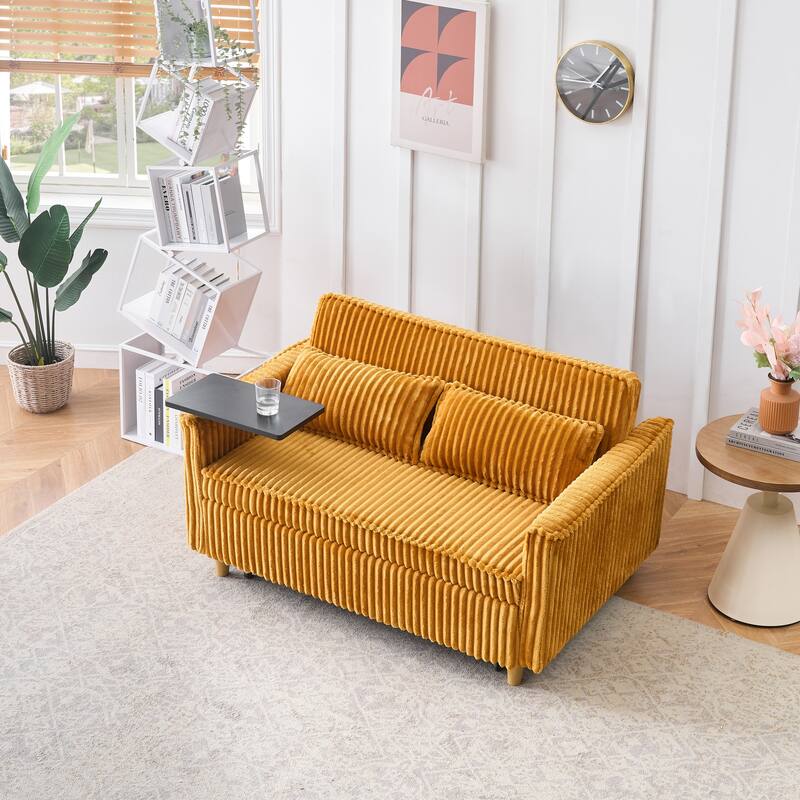 The pull-out and push-in green corduroy sofa with dual functions,equipped with a movable tabletop and USB ports
