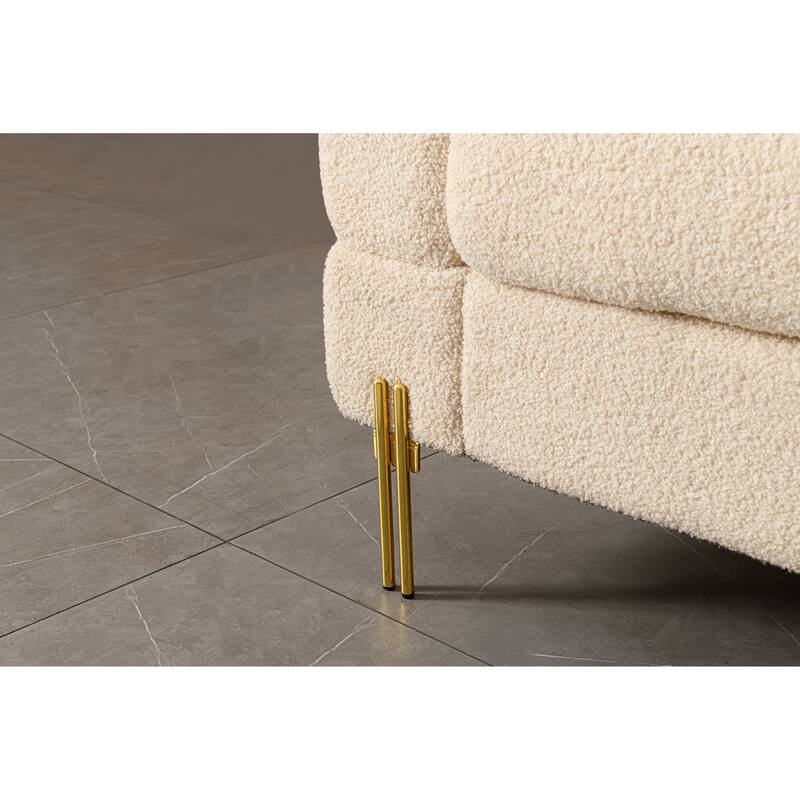 Luxurious and comfortable upholstered sofa with golden legs and pillows for living room and reception area