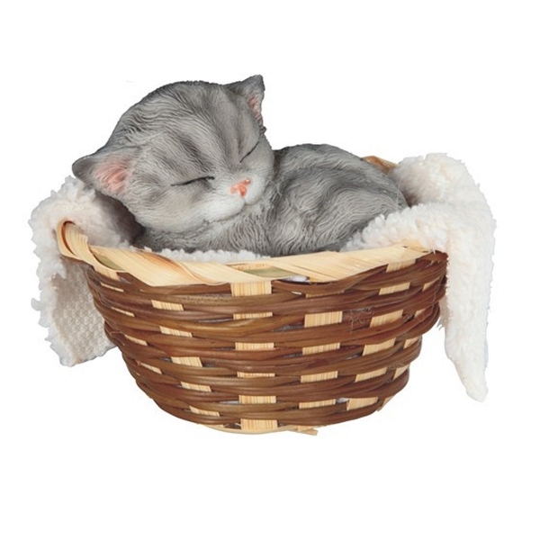 sleeping cat in basket toy
