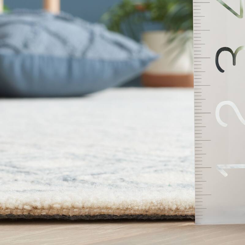 SAFAVIEH Handmade Ebony Rumjana Modern Wool Rug