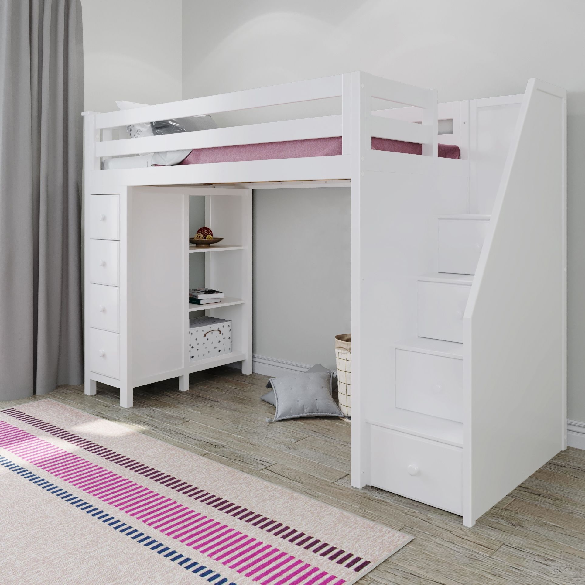 A wooden loft bed with stairs and integrated desk and storage in a light gray finish. Includes chest of drawers on left, open shelving under loft, and a desk area beneath with shelves and a fabric storage box. Room with large window and pale decor.
