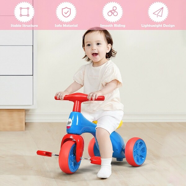 kid riding tricycle