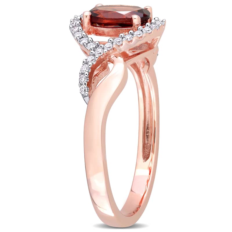 Miadora 10k Rose Gold Garnet and 1/6ct TDW Diamond Halo Infinity Ring