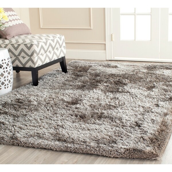 Safavieh Handmade South Beach Leonella Shag Solid Polyester Rug. Opens flyout.