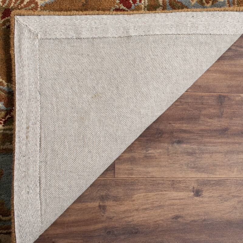 SAFAVIEH Handmade Heritage Full Bloom Traditional Oriental Wool Rug - 7'6" x 9'6" Oval - Brown/Blue