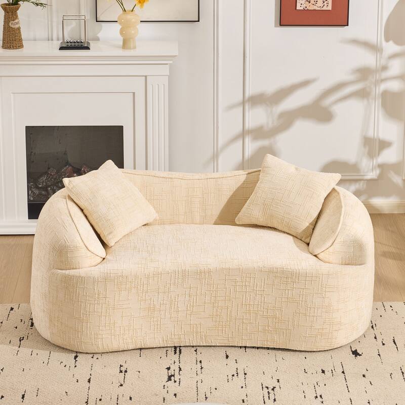 Curved 2 person compress sofa. It has armrests on both sides, comes with two pillows,is suitable for small - sized apartments