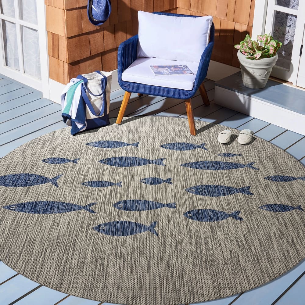 Isola Tropical Indoor/Outdoor Area Rug by Porch & Den