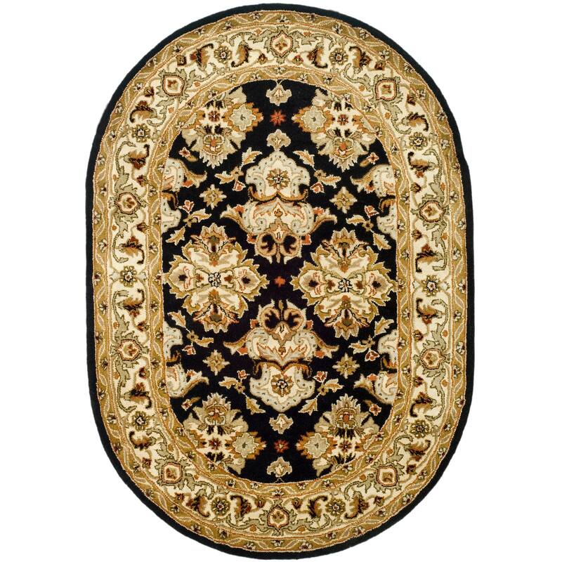 SAFAVIEH Handmade Heritage Ogee Dot Traditional Oriental Wool Rug - 4'6" x 6'6" Oval - Black/Ivory