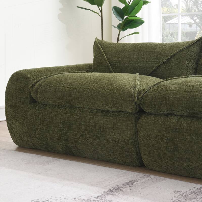 Versatile Compressed Sofa with Integrated Cushions and Movable Ottoman