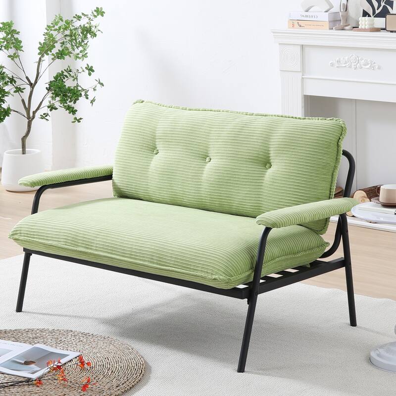 The 53-inch black sofa offers a spacious layout in the small apartment