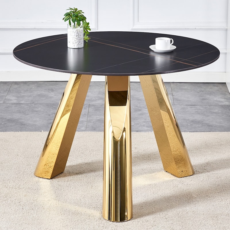 A 42-Inch Round Table with Stainless Steel Legs and a Marble Top, Perfect for 4 to 6 People.