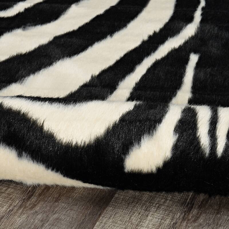 Faux Cowhide Area Rug - 5' x 6'6"