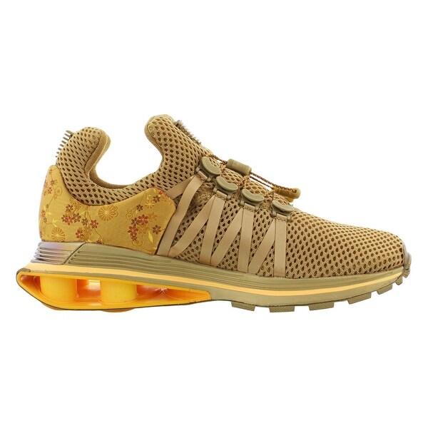 nike shox gravity metallic gold women's shoe